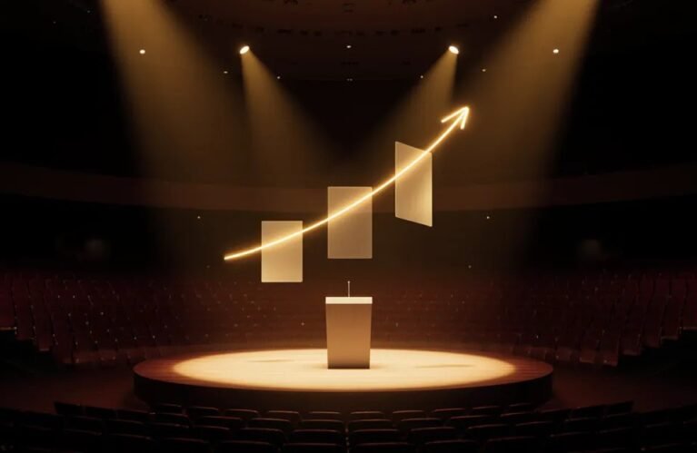 AdMagic CIBC Biz Pitch semi-finalist, spotlit pitch stage with a rising golden growth line in an empty auditorium